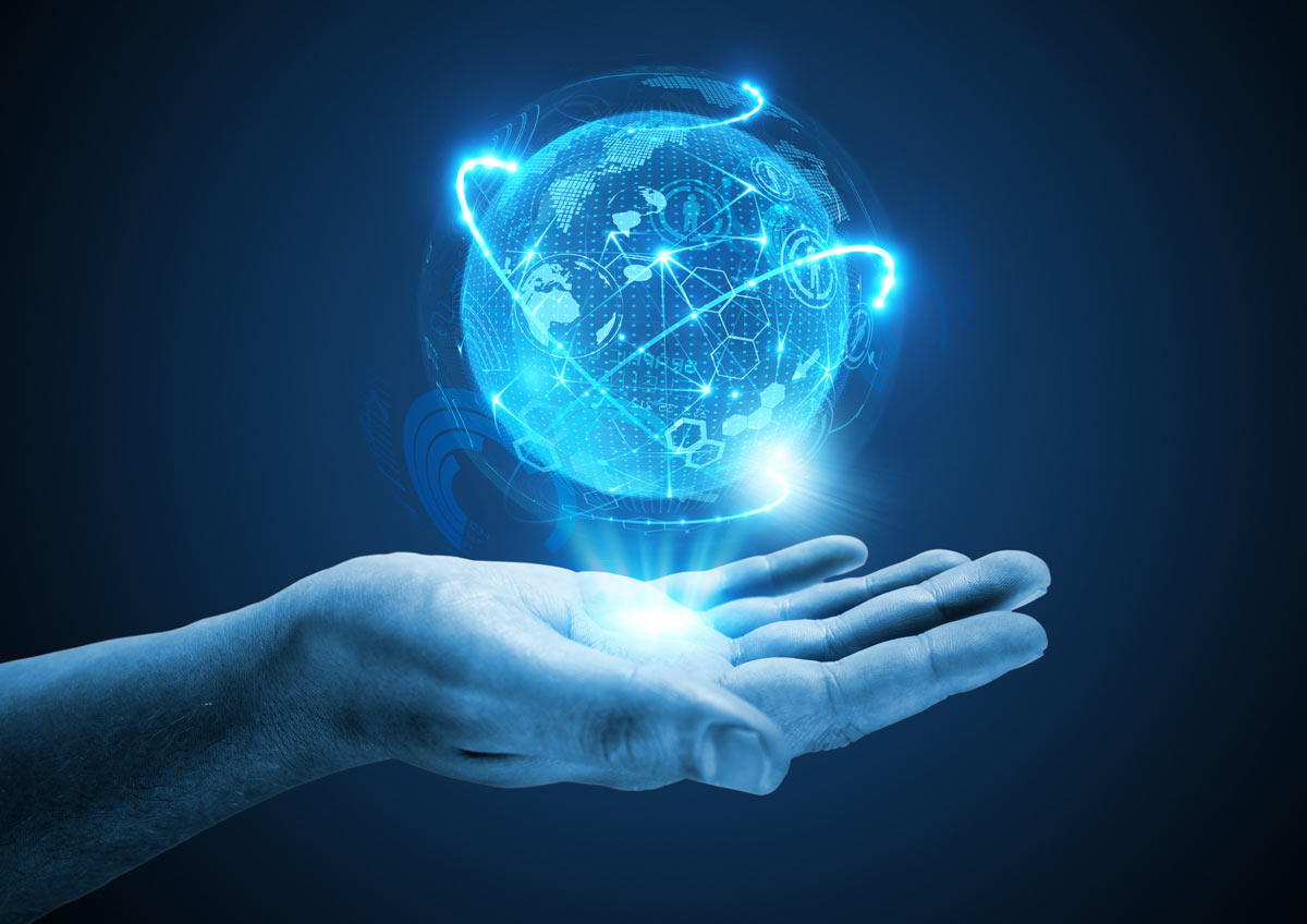 Image of a hand outstretched with a high tech blue-lit globe floating above it